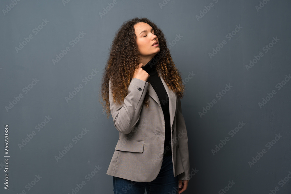 Teenager girl over blue wall with tired and sick expression Teenager girl over blue wall with tired and sick expression