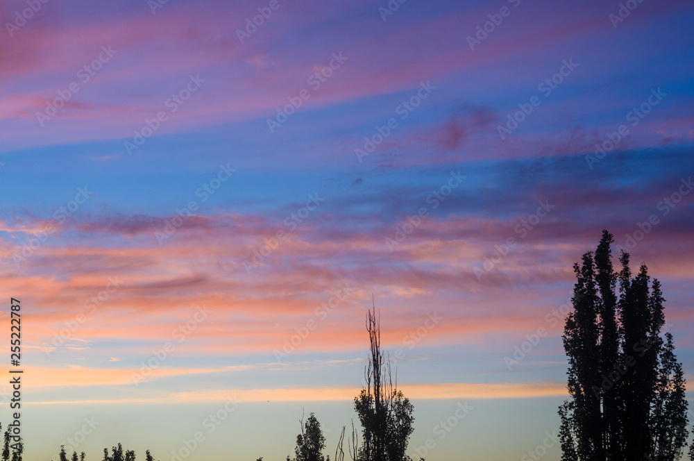 Landscape with dramatic light - beautiful golden sunset with saturated sky and clouds. Landscape with dramatic light - beautiful golden sunset with saturated sky and clouds.