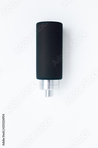 Black silicone bottle on the white background, close up photo