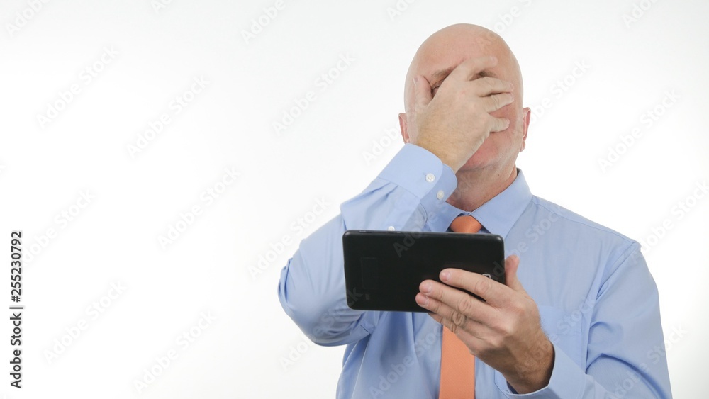 Businessman Gesturing Nervous and Unhappy After Reading Bad Message on Table