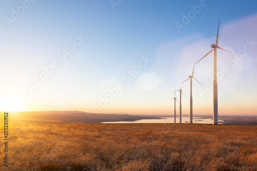 Wind turbines sustainable renewable green energy production technology photo