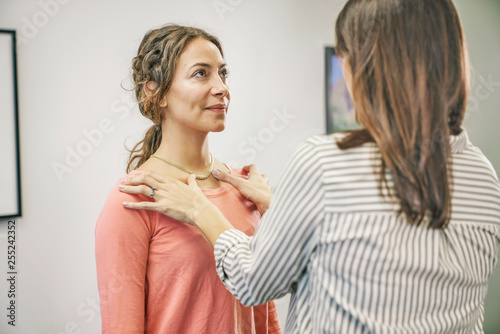 Physiotherapist giving therapy to her patient in clinic