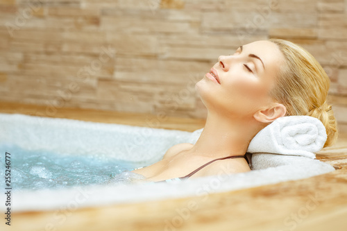 Beauty needs rest. Horizontal shot of a woman enjoying her time in the Jacuzzi with her eyes closed