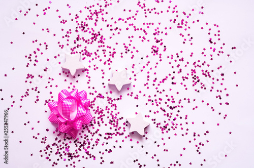 Festive decorations.  Wooden and purple stars on white background. 