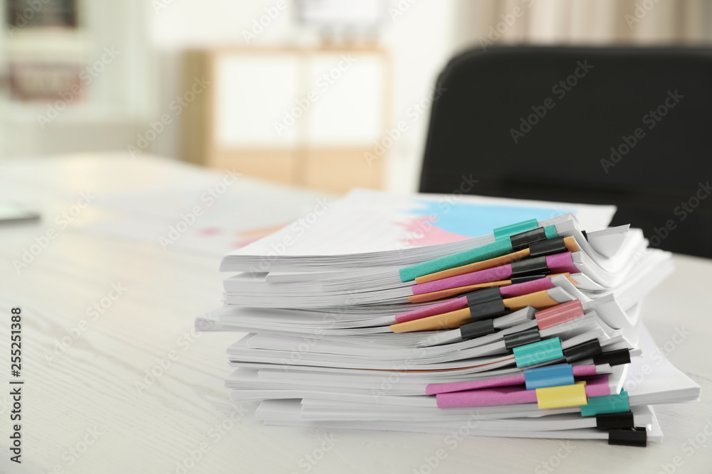 Stack of documents with paper clips on office table Stack of documents with paper clips on office table