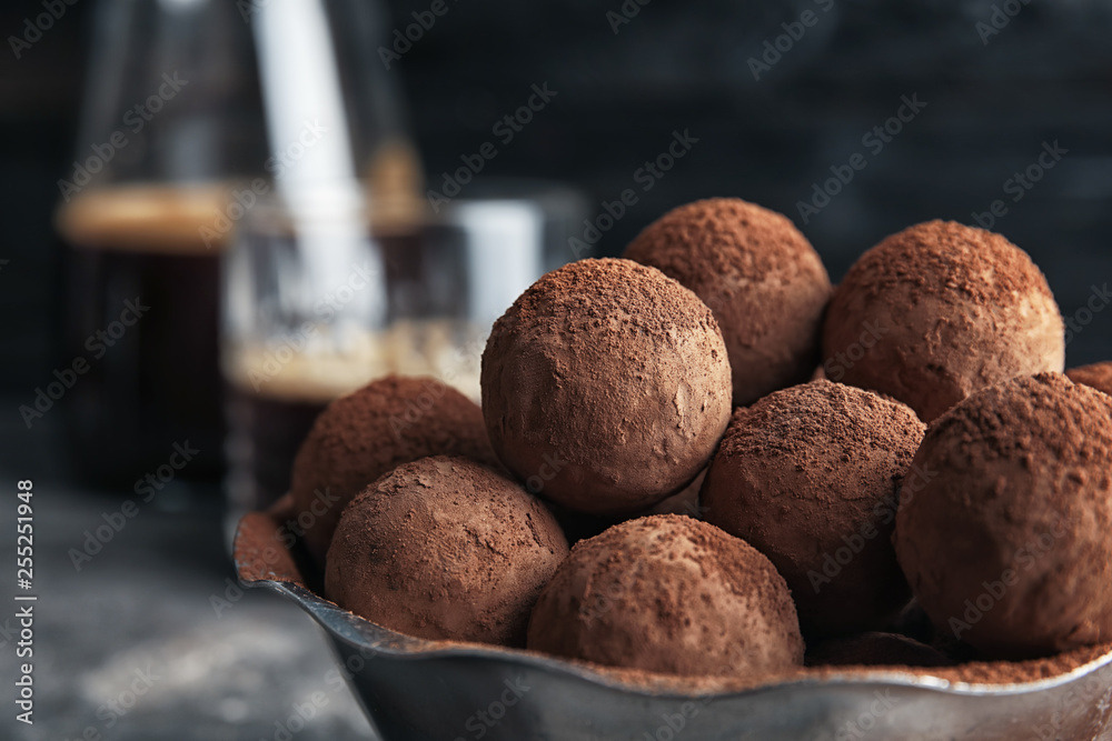 Bowl with tasty chocolate truffles, closeup view Bowl with tasty chocolate truffles, closeup view