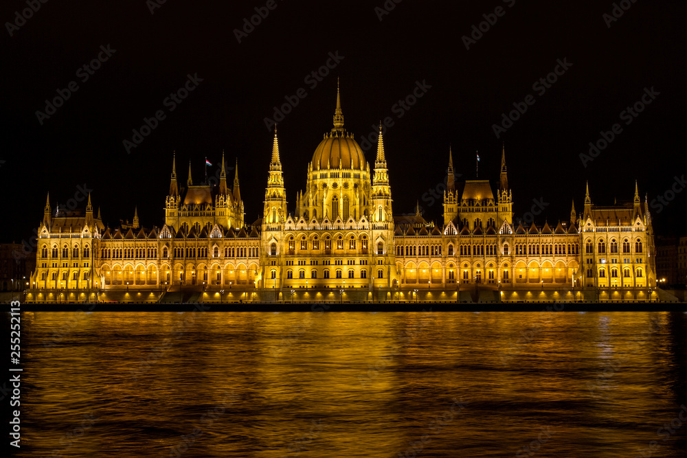 View on the The Hungarian Parliament Building, beside the Danube River. European travel.  Night scene.  Budapest. Hungarian landmarks.