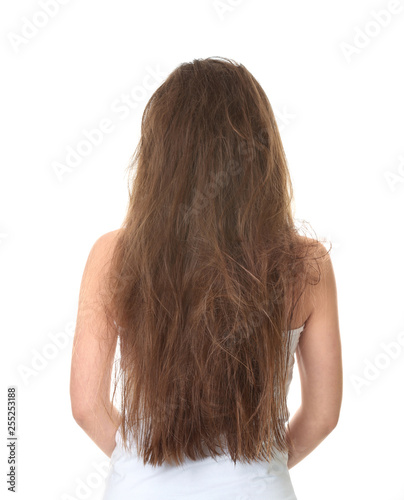 Woman with tangled brown hair on white background