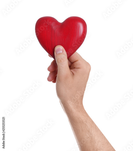 Man holding decorative heart in hand on white background  closeup