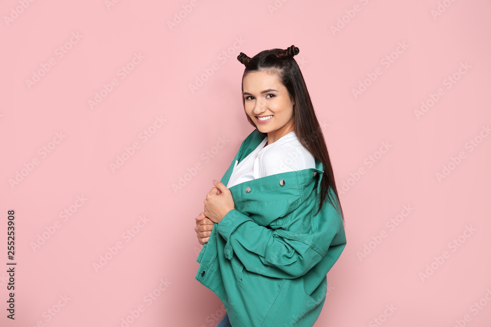 Portrait of beautiful young woman in stylish clothes on color background Portrait of beautiful young woman in stylish clothes on color background