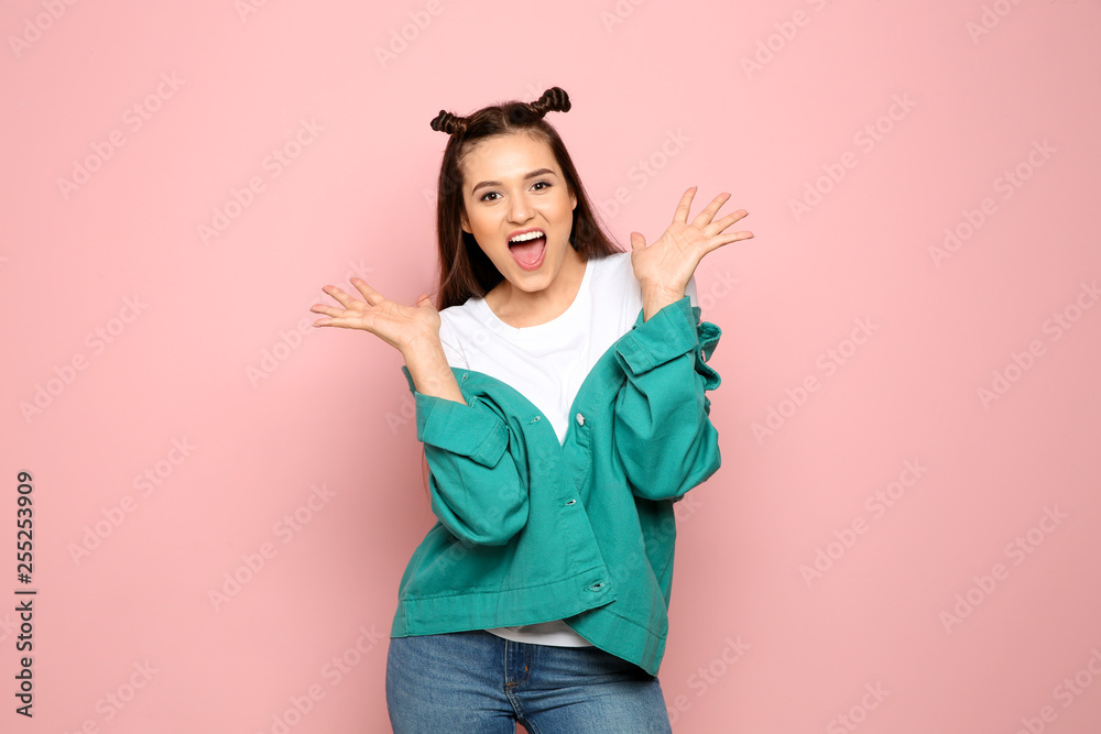 Portrait of emotional young woman in stylish clothes on color background Portrait of emotional young woman in stylish clothes on color background