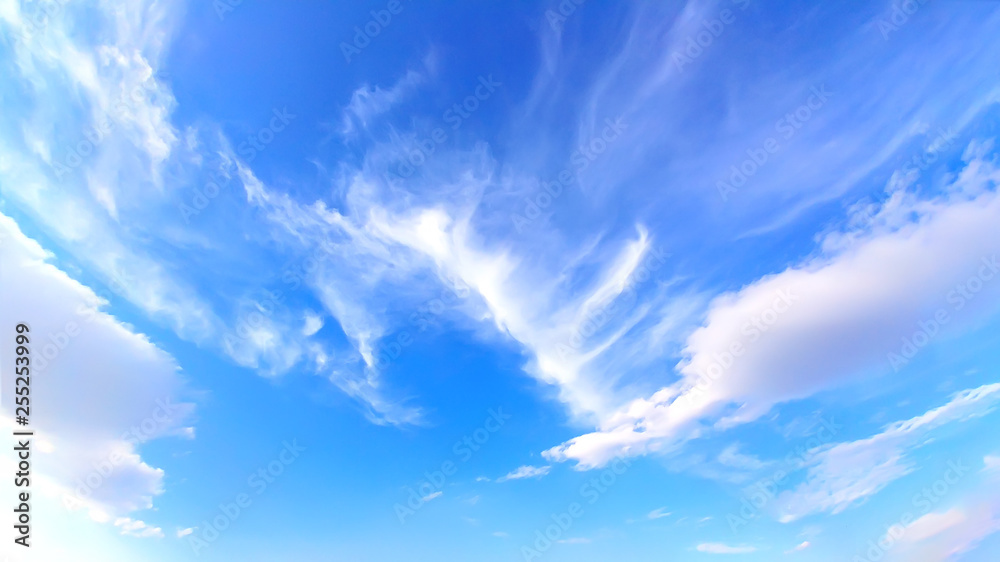 blue sky with cirrus clouds.
