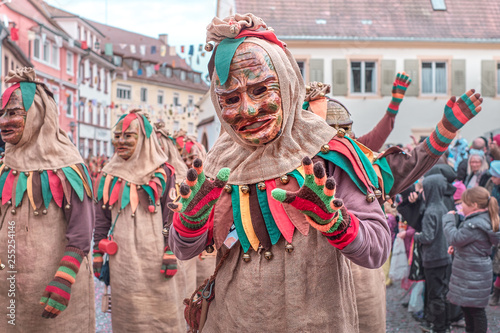 Friendly carnival figure with costume of sack cloth. Street Carnival in Southern Germany - Black Forest.