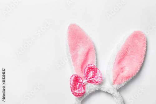 Funny headband with Easter bunny ears on white background, top view