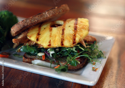 Grilled Sandwich with Pineapple on table in restaurant photo