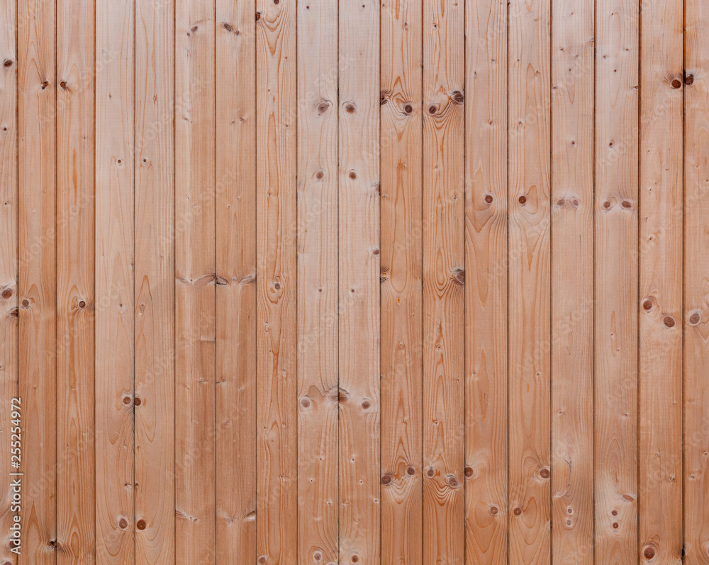 Fototapeta premium Full frame background of a new, clean and unpainted wood board wall.