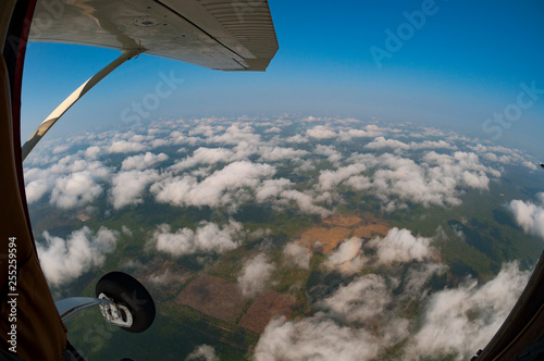 Looking out from Cessna plane  no door