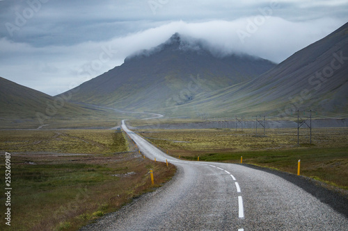 Asphalt curvy road in Iceland at summer season photo