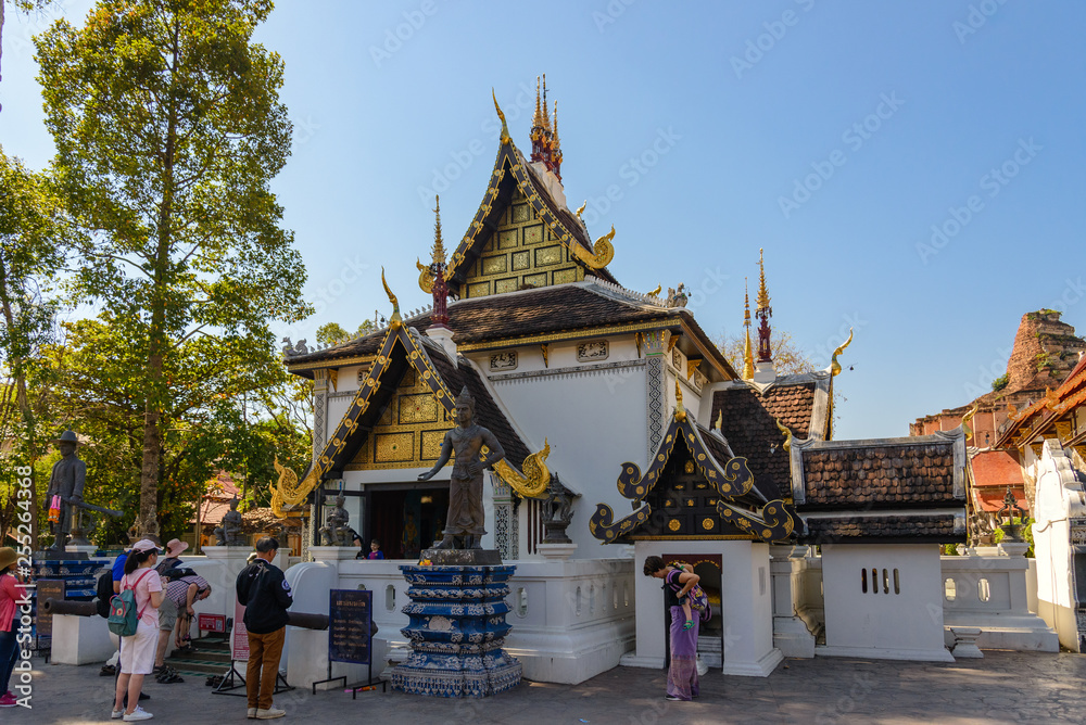 Outdoor sunny view of small beautiful Thai temple in Wat Chedi Luang, famous and renown historical religious architecture in Northern Thailand.