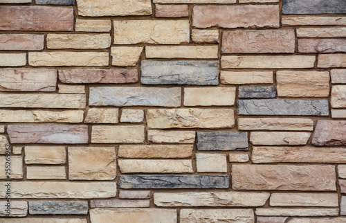 Brown colored stone setting. Cut stone wall texture