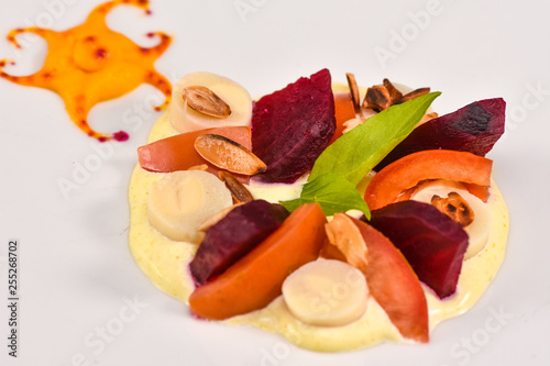 esh vegetable salad with boiled beet, mangold leaves, walnuts and quail eggs photo