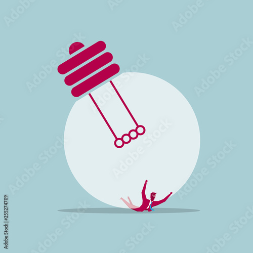 Businessman crushed beneath the lamp,background is blue.