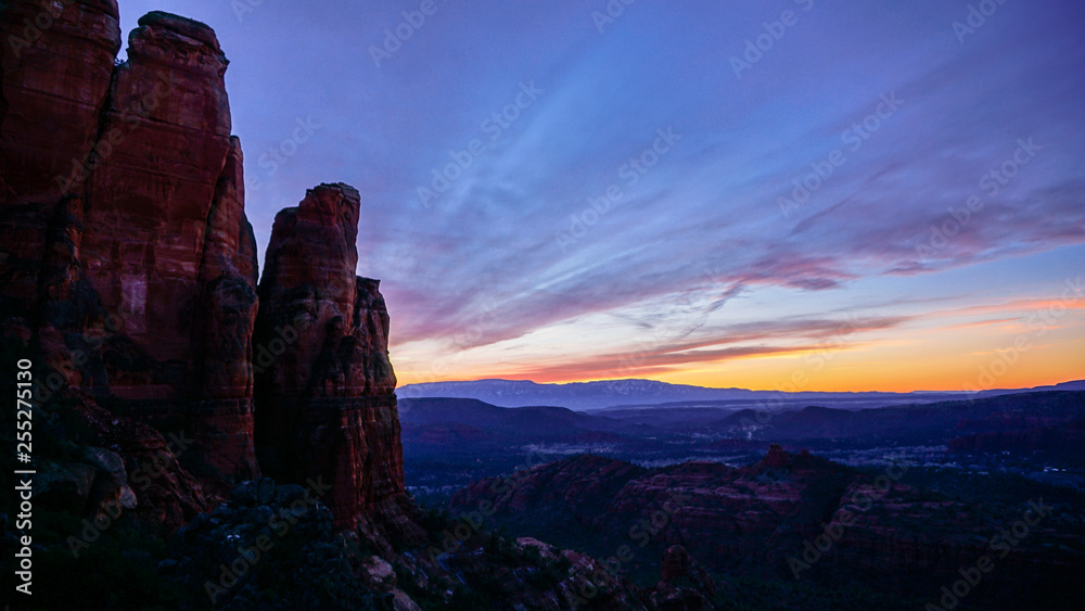 Aerial View of Sedona Red Rocks in Arizona with Beautiful Purple Skies with Clouds and Sunset