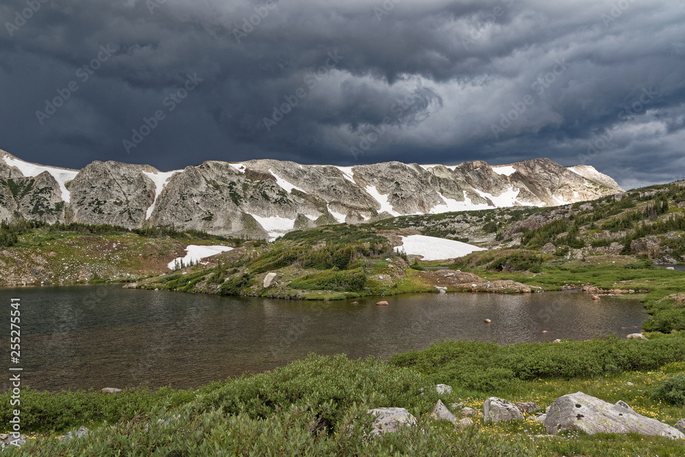 Fotografie Storm clouds brew over the Snowy Range of Wyoming