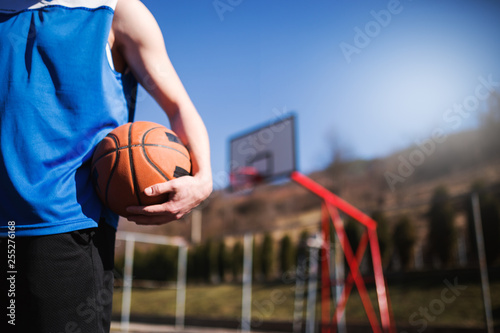 Basketball player holding ball,sport concept