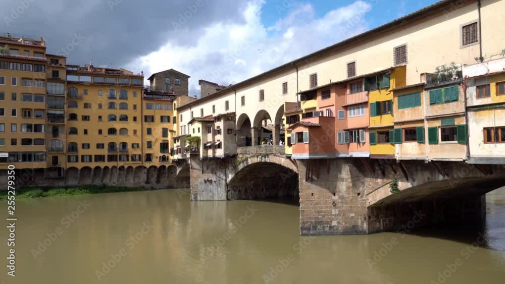 Beautiful view on the Ponte Vecchio Bridge with a Corridoio Vasariano and the Arno River in Florence, Tuscany, Italy Beautiful view on the Ponte Vecchio Bridge with a Corridoio Vasariano and the Arno River in Florence, Tuscany, Italy