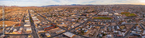 Aerial view of Barstow community a residential city of homes and commercial property community Mojave desert California USA at sunset photo