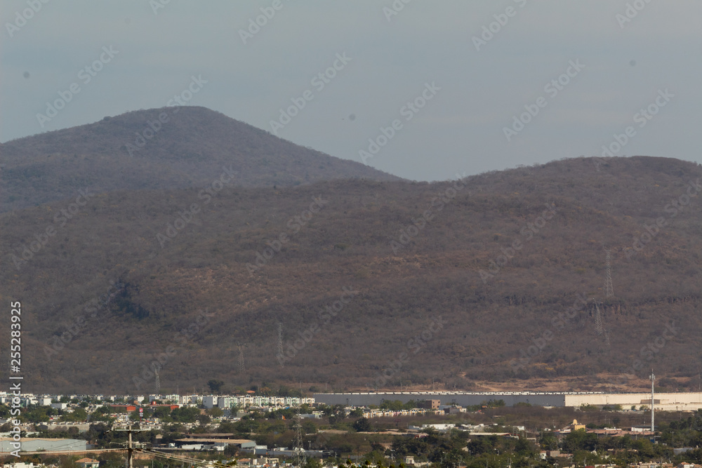 Mountain with antennas and dry trees located in the southern part of Culiacan, Sinaloa, Mexico.
