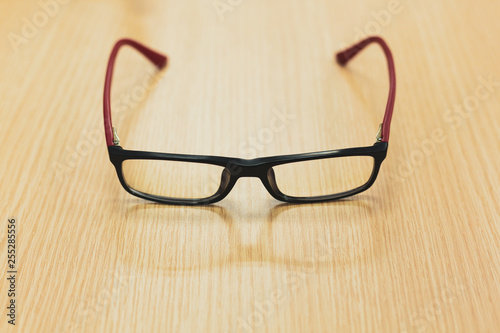 eyeglasses on wooden table office