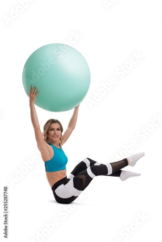 Woman doing fitness with fitball isolated shot