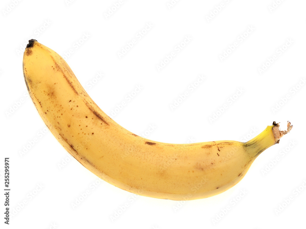 One yellow very ripe banana isolated on white background close up