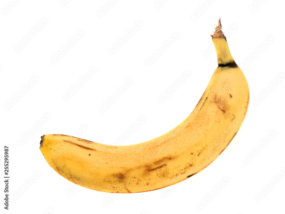 One yellow very ripe banana isolated on white background close up One yellow very ripe banana isolated on white background close up