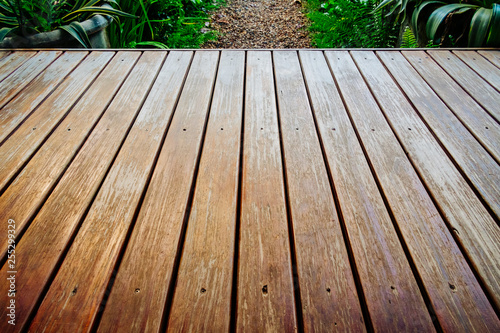 Old wooden deck in garden.