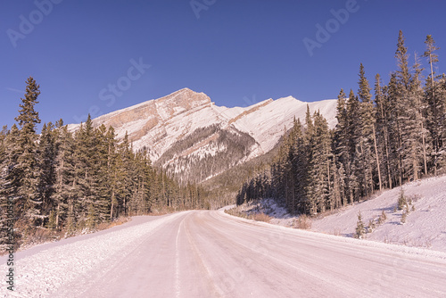 Snowy Mountain Road with Blue Sky