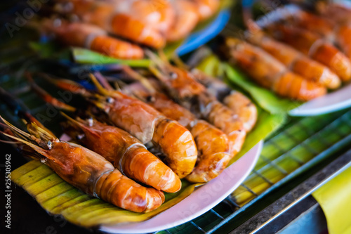 shrimp burned on plate with green leave in thai restaurant