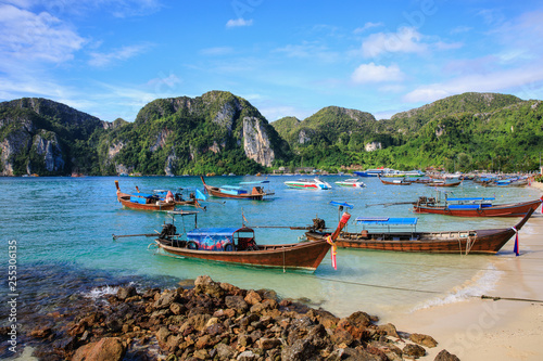 phi phi island kra bi Thailand - December 8,2018 long tail boat on the sand in the sea at phi phi island