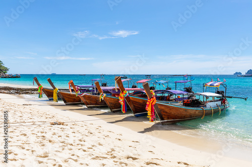 phi phi island kra bi Thailand - December 8,2018 long tail boat on the sand in the sea at phi phi island