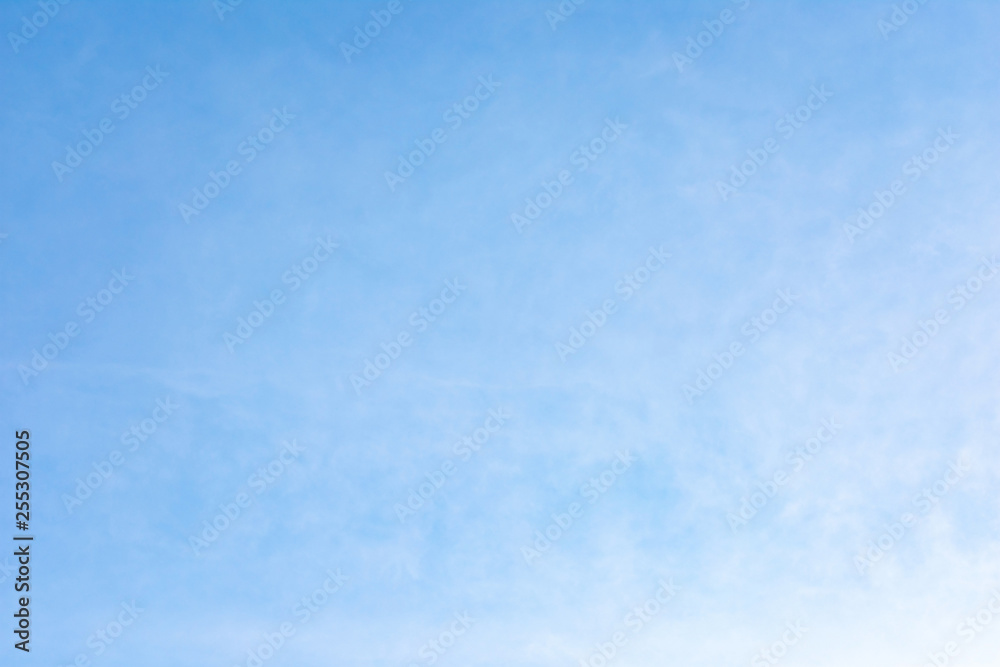 Beautiful, abstract, blue sky background. There are feathery clouds in the sky. A good place to place the text. Beautiful, abstract, blue sky background. There are feathery clouds in the sky. A good place to place the text.
