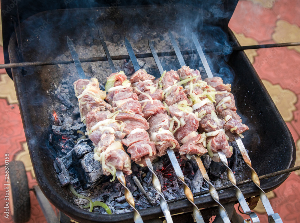 cooking grilled shish kebab on metal skewer fresh meat. cooked at barbecue bbq roasted beef meat
