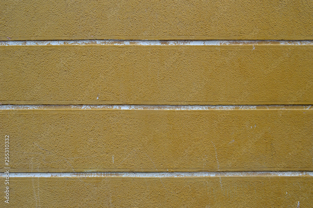 Fototapeta premium yellow wall with white lines of concrete