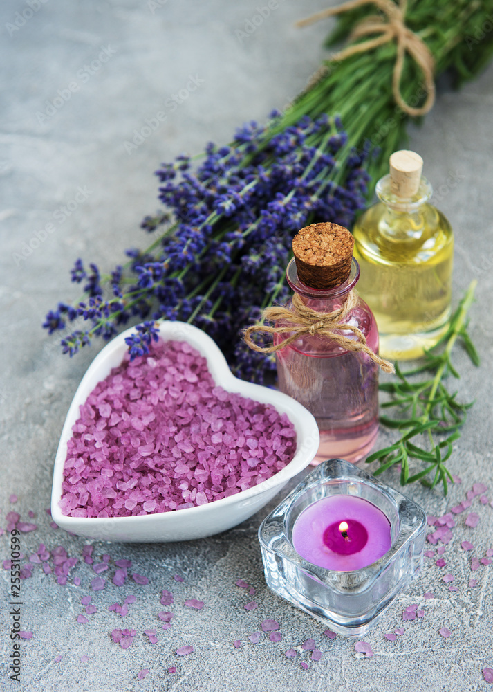 Heart-shaped bowl with sea salt and fresh lavender flowers Heart-shaped bowl with sea salt and fresh lavender flowers