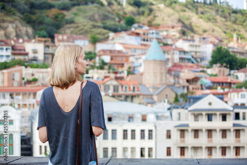Woman tourist looking at the panorama of Tbilisi