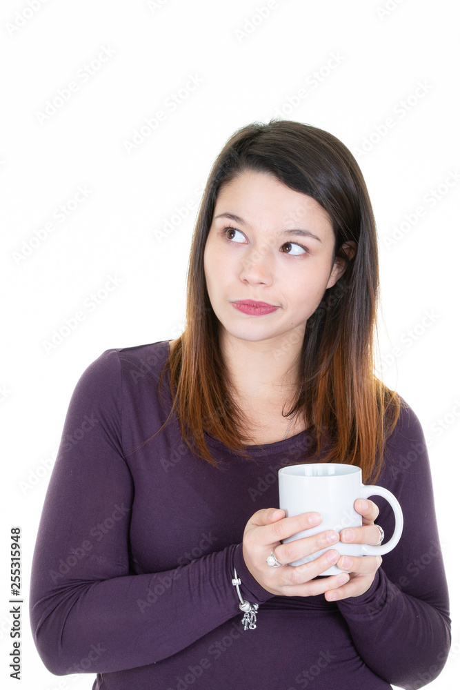 young woman with cup mug of coffee looks up make funny face young woman with cup mug of coffee looks up make funny face