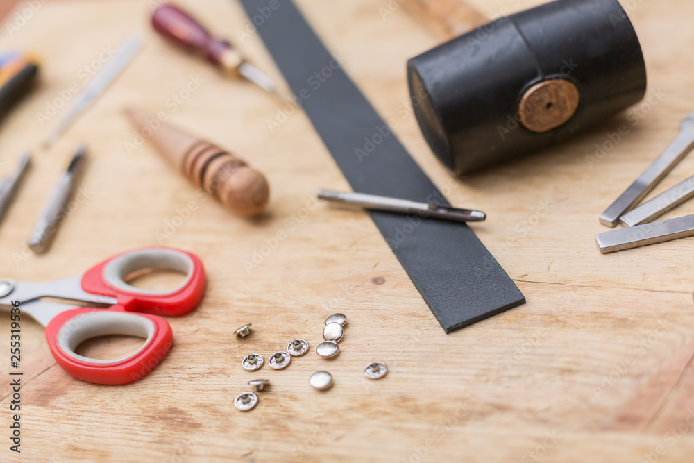 Fototapeta premium making leather belt with tools