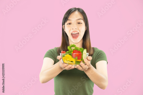 Happy lady holding kichen stuff over copy space background - people home made food preparation concept