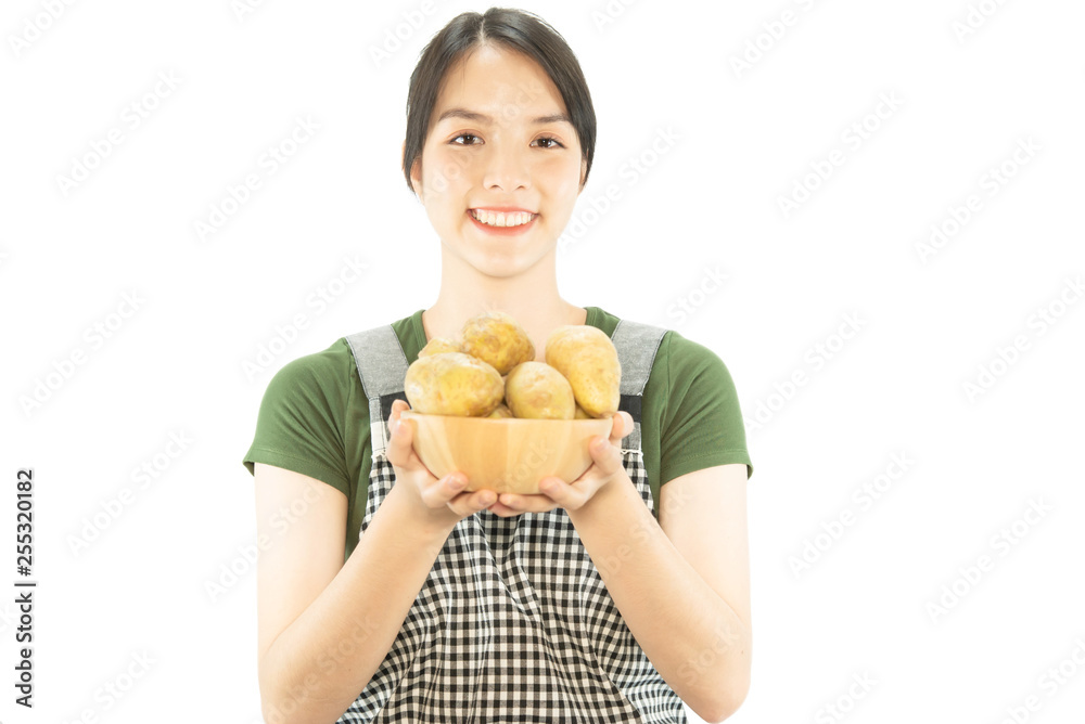 Happy lady holding kichen stuff over copy space background - people home made food preparation concept Happy lady holding kichen stuff over copy space background - people home made food preparation concept
